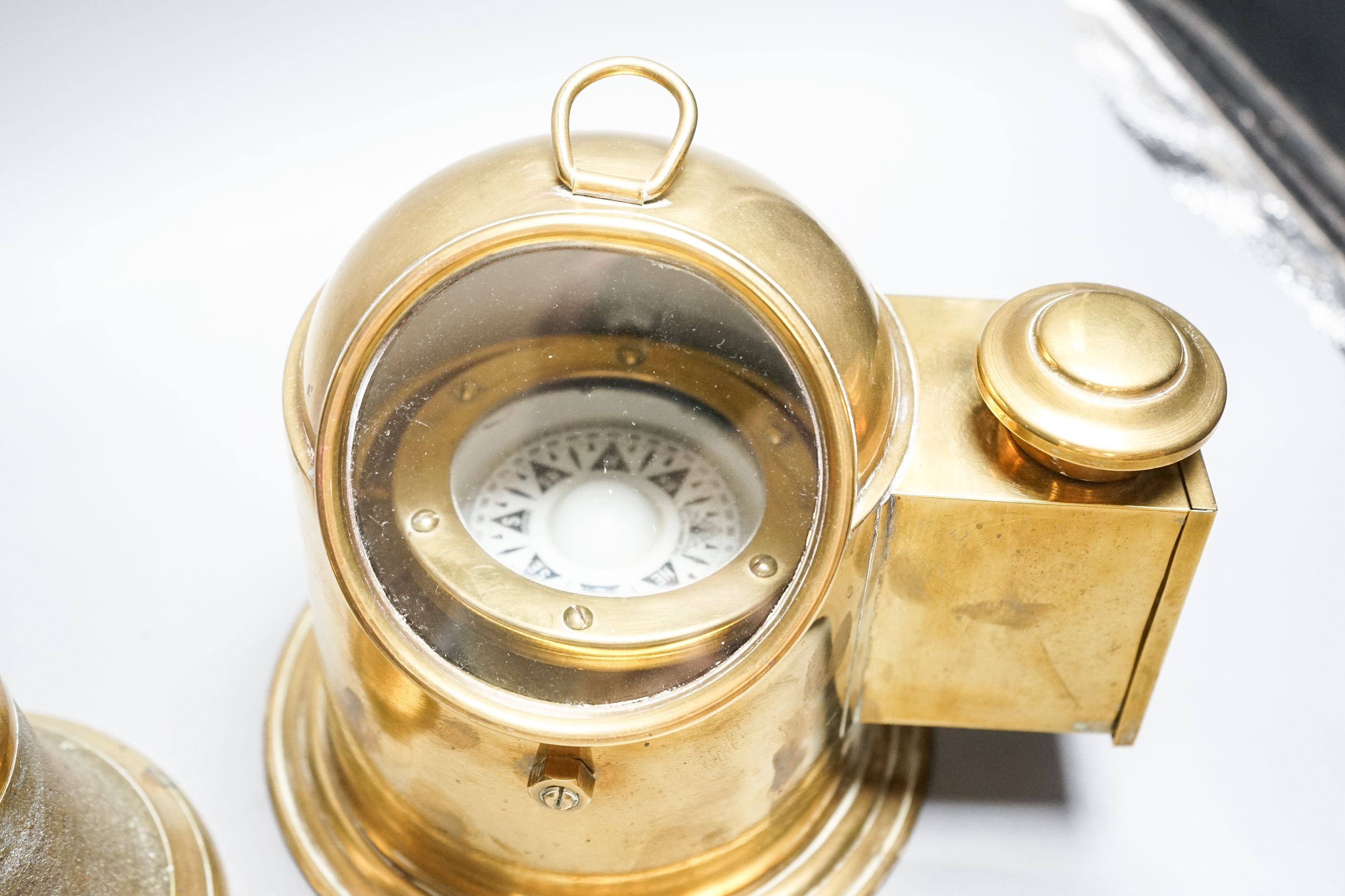 A brass ships binnacle compass and a handbell